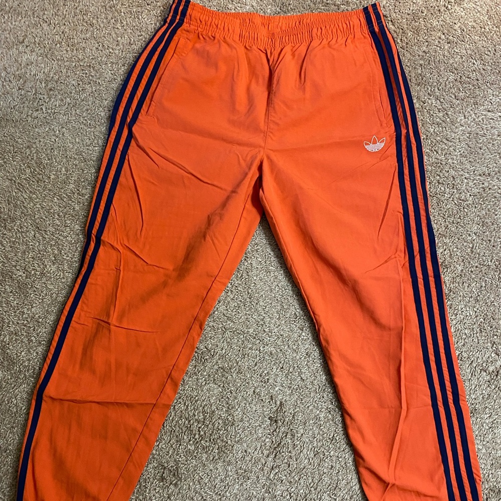 Orange Adidas track pants